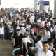 Passengers stranded at Kansai International Airport due to typhoon Jebi waited for a special bus service to transport them out of the area.